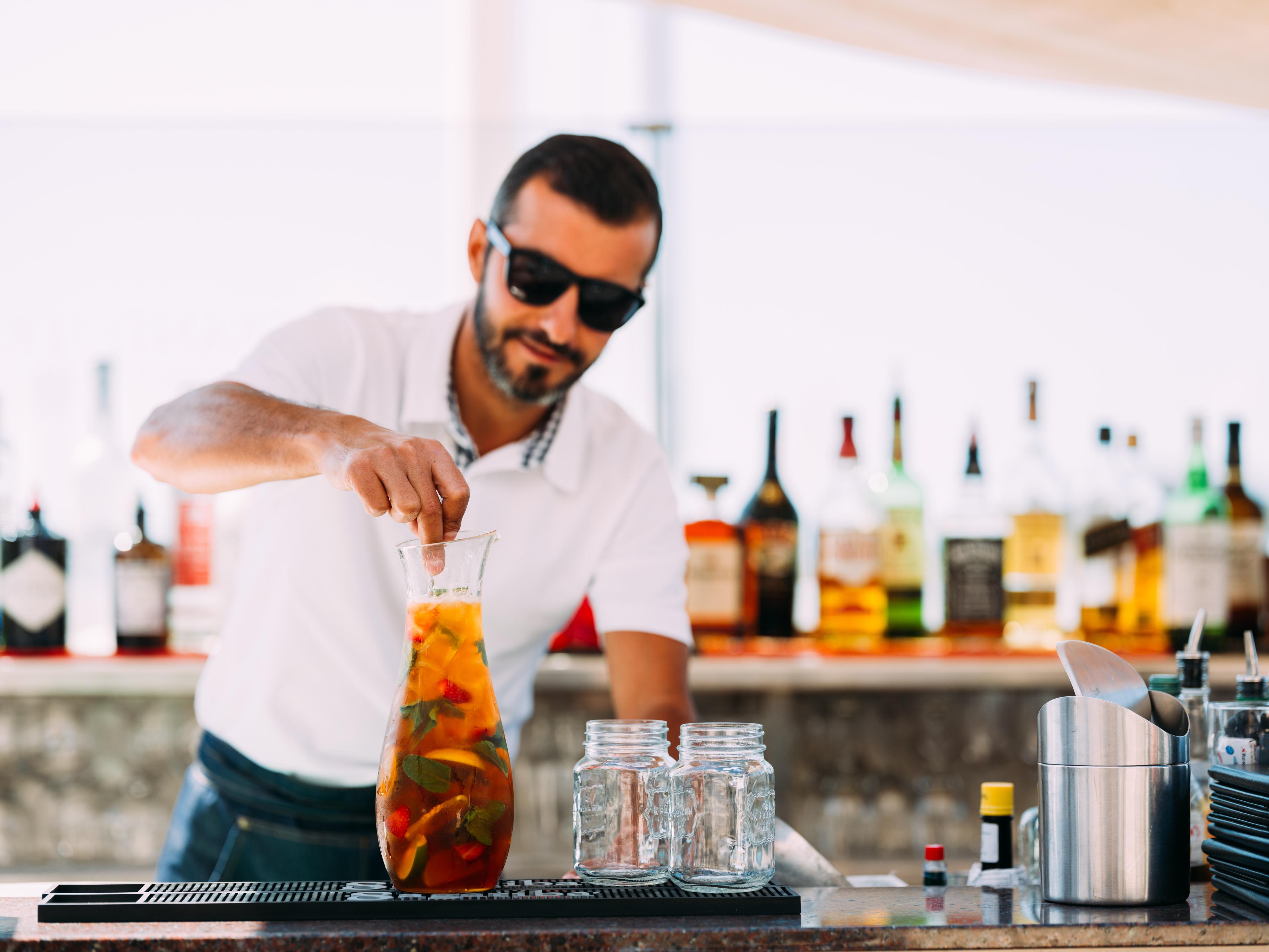 Grand Jersey Hotel And Spa Saint Helier Bagian luar foto Bartender preparing a cocktail
